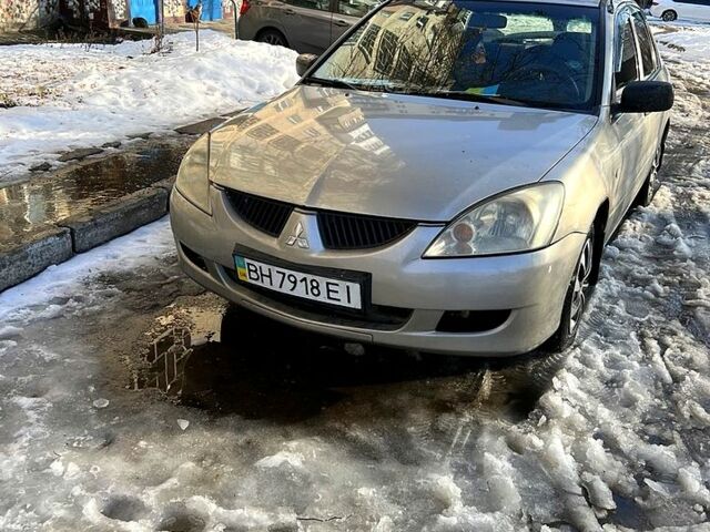 Серый Мицубиси Лансер, объемом двигателя 1.3 л и пробегом 340 тыс. км за 2200 $, фото 1 на Automoto.ua