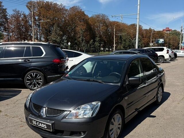 Сірий Міцубісі Lancer, об'ємом двигуна 1.58 л та пробігом 174 тис. км за 4500 $, фото 1 на Automoto.ua
