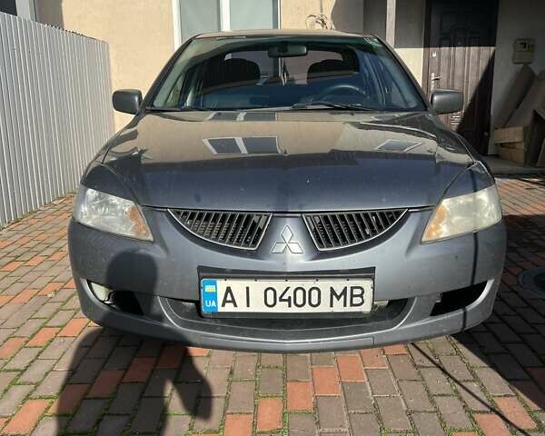 Сірий Міцубісі Lancer, об'ємом двигуна 1.58 л та пробігом 262 тис. км за 3900 $, фото 1 на Automoto.ua
