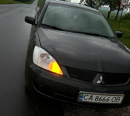 Сірий Міцубісі Lancer, об'ємом двигуна 1.6 л та пробігом 257 тис. км за 3100 $, фото 1 на Automoto.ua