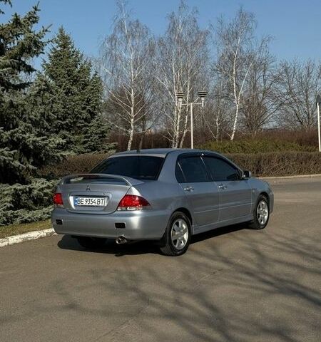 Серый Мицубиси Лансер, объемом двигателя 1.58 л и пробегом 164 тыс. км за 4600 $, фото 1 на Automoto.ua