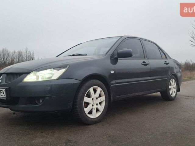 Сірий Міцубісі Lancer, об'ємом двигуна 1.58 л та пробігом 320 тис. км за 3800 $, фото 1 на Automoto.ua