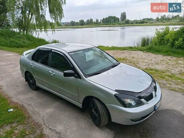 Сірий Міцубісі Lancer, об'ємом двигуна 2 л та пробігом 240 тис. км за 4000 $, фото 1 на Automoto.ua