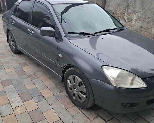 Сірий Міцубісі Lancer, об'ємом двигуна 1.58 л та пробігом 290 тис. км за 3900 $, фото 1 на Automoto.ua