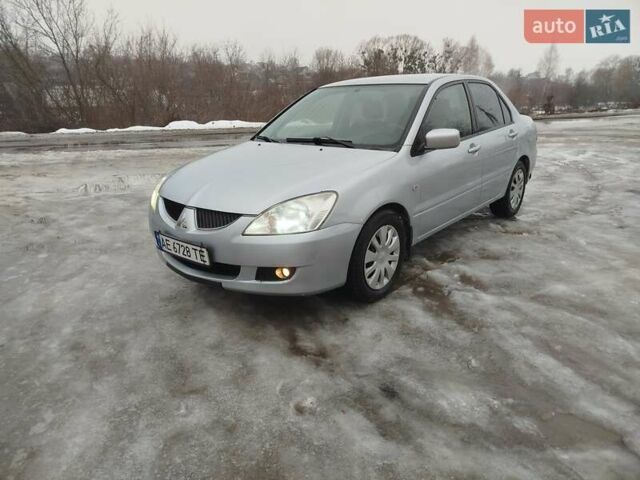 Серый Мицубиси Лансер, объемом двигателя 1.58 л и пробегом 280 тыс. км за 3800 $, фото 1 на Automoto.ua