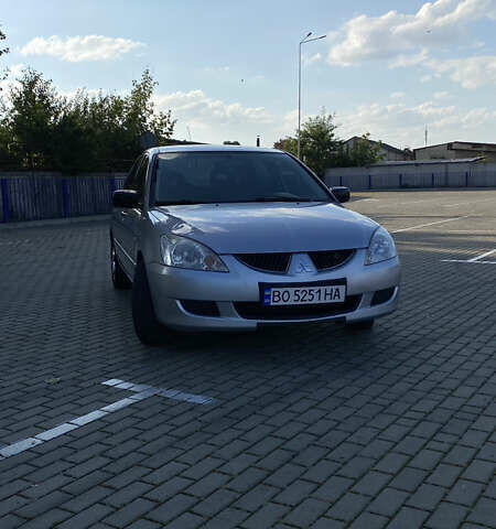 Сірий Міцубісі Lancer, об'ємом двигуна 1.58 л та пробігом 270 тис. км за 1999 $, фото 1 на Automoto.ua