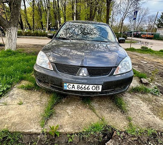 Серый Мицубиси Лансер, объемом двигателя 1.6 л и пробегом 0 тыс. км за 2900 $, фото 1 на Automoto.ua