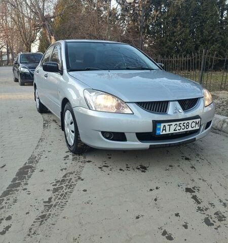 Сірий Міцубісі Lancer, об'ємом двигуна 1.58 л та пробігом 325 тис. км за 4200 $, фото 1 на Automoto.ua