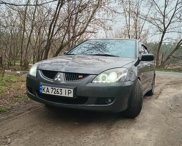 Серый Мицубиси Лансер, объемом двигателя 1.58 л и пробегом 330 тыс. км за 4300 $, фото 1 на Automoto.ua