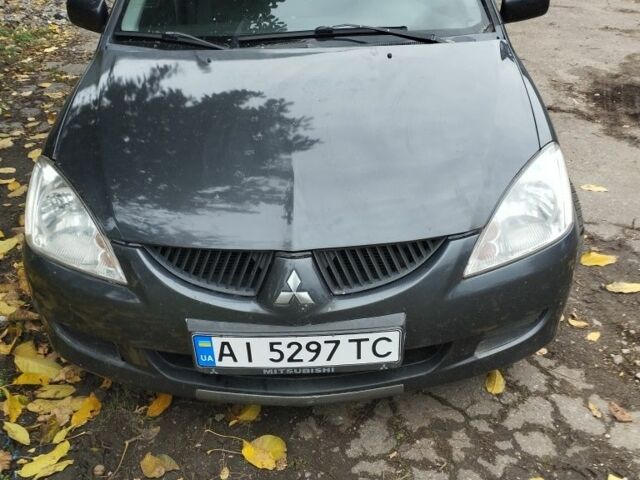 Серый Мицубиси Лансер, объемом двигателя 1.6 л и пробегом 345 тыс. км за 2600 $, фото 1 на Automoto.ua
