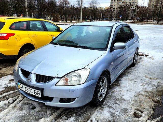 Серый Мицубиси Лансер, объемом двигателя 2 л и пробегом 333 тыс. км за 3100 $, фото 1 на Automoto.ua