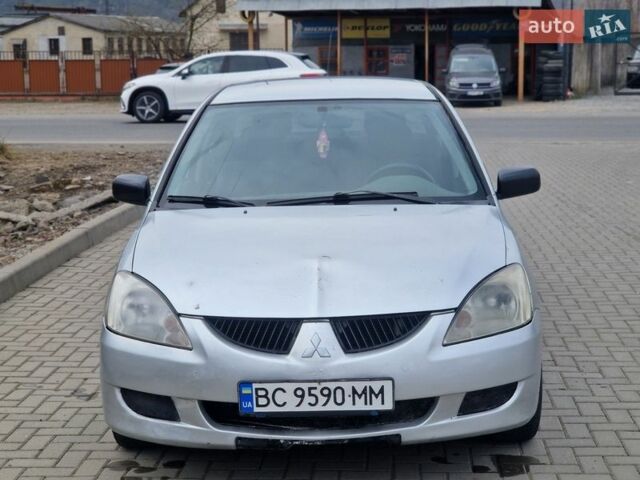 Сірий Міцубісі Lancer, об'ємом двигуна 1.58 л та пробігом 360 тис. км за 2850 $, фото 1 на Automoto.ua