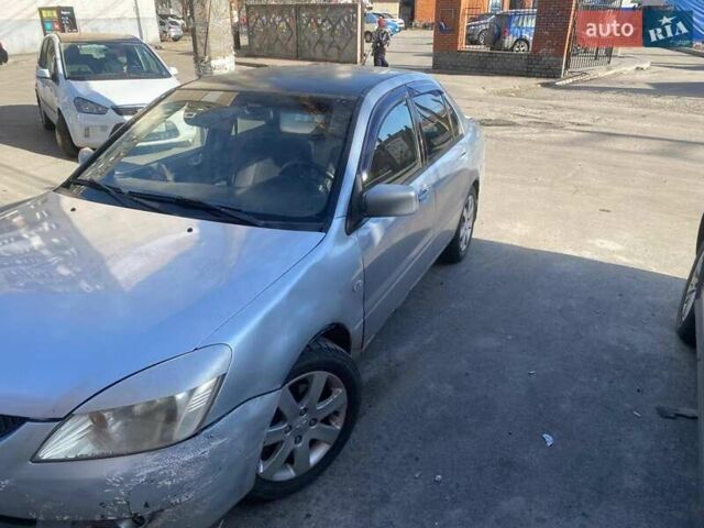 Серый Мицубиси Лансер, объемом двигателя 1.6 л и пробегом 290 тыс. км за 1800 $, фото 1 на Automoto.ua