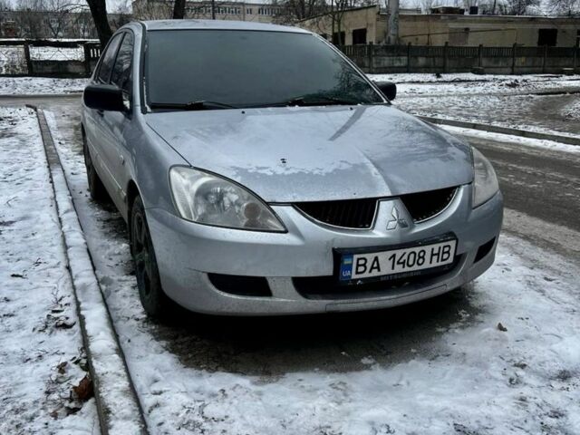 Серый Мицубиси Лансер, объемом двигателя 1.6 л и пробегом 340 тыс. км за 3100 $, фото 1 на Automoto.ua