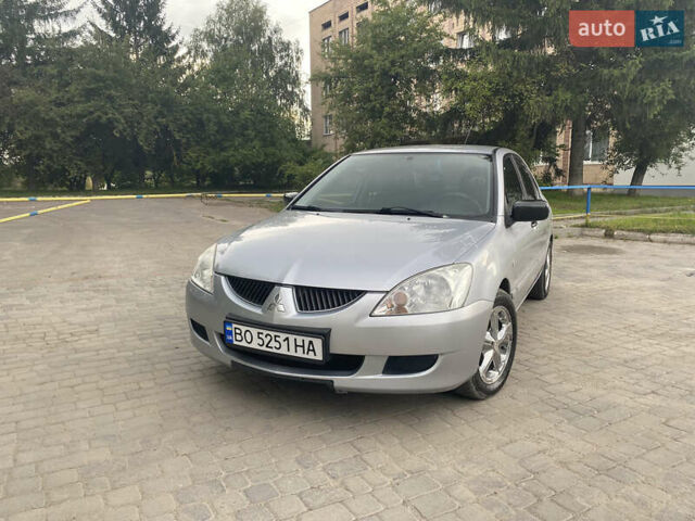 Сірий Міцубісі Lancer, об'ємом двигуна 1.58 л та пробігом 268 тис. км за 3799 $, фото 1 на Automoto.ua