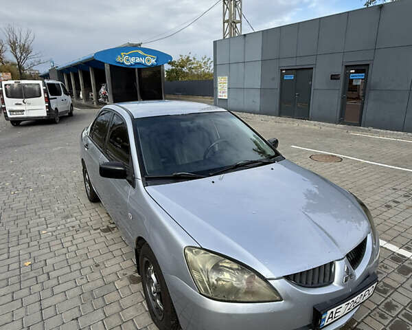 Серый Мицубиси Лансер, объемом двигателя 1.29 л и пробегом 263 тыс. км за 3400 $, фото 1 на Automoto.ua