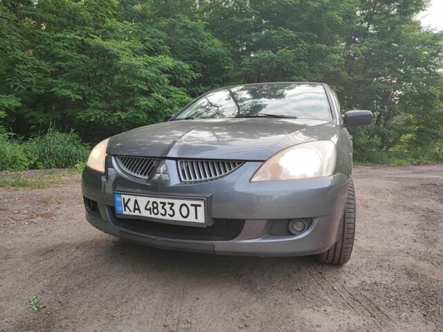 Серый Мицубиси Лансер, объемом двигателя 1.5 л и пробегом 274 тыс. км за 2400 $, фото 1 на Automoto.ua