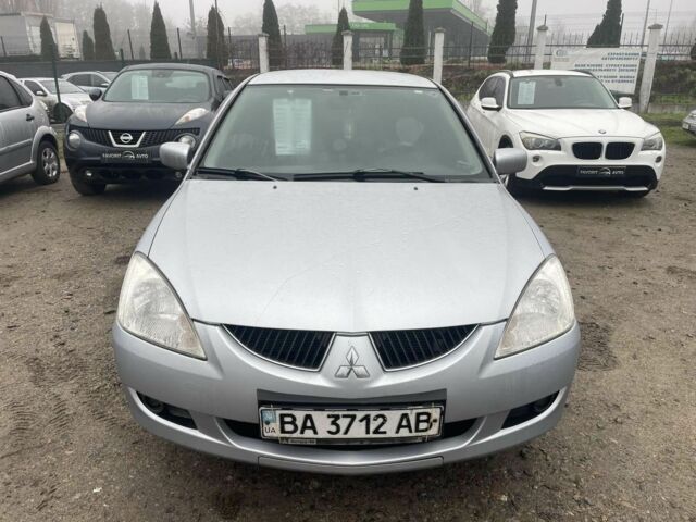 Серый Мицубиси Лансер, объемом двигателя 1.6 л и пробегом 200 тыс. км за 3906 $, фото 1 на Automoto.ua