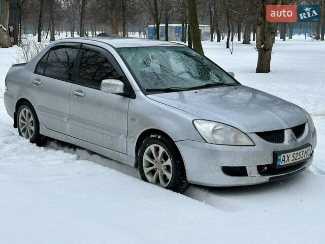 Сірий Міцубісі Lancer, об'ємом двигуна 1.6 л та пробігом 256 тис. км за 3700 $, фото 1 на Automoto.ua