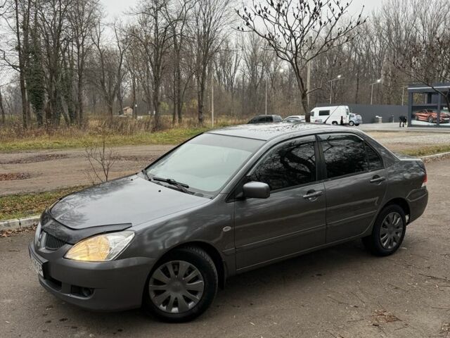 Сірий Міцубісі Lancer, об'ємом двигуна 1.6 л та пробігом 230 тис. км за 2799 $, фото 1 на Automoto.ua