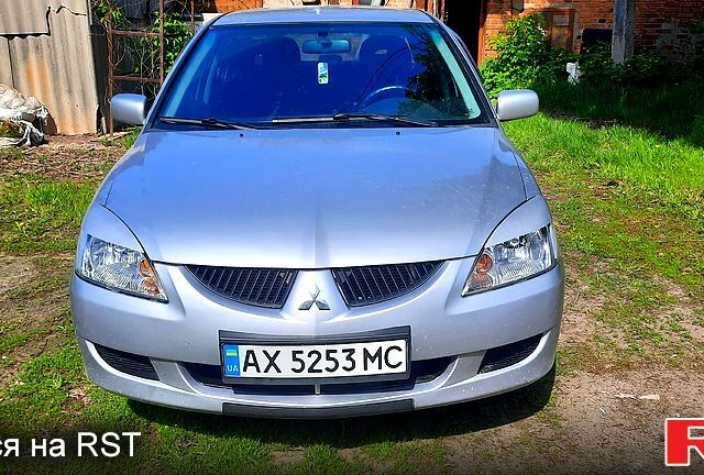 Серый Мицубиси Лансер, объемом двигателя 1.6 л и пробегом 250 тыс. км за 5000 $, фото 1 на Automoto.ua