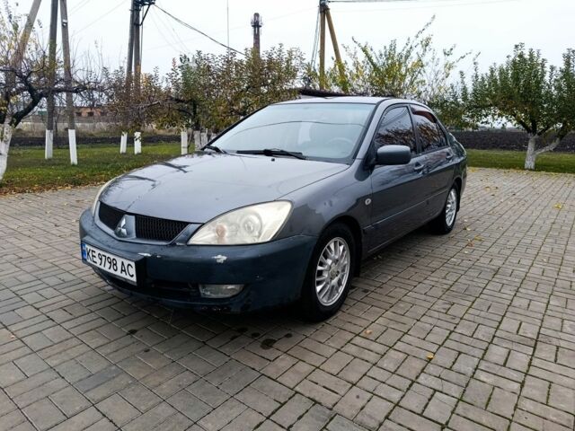 Серый Мицубиси Лансер, объемом двигателя 1.6 л и пробегом 100 тыс. км за 3500 $, фото 1 на Automoto.ua