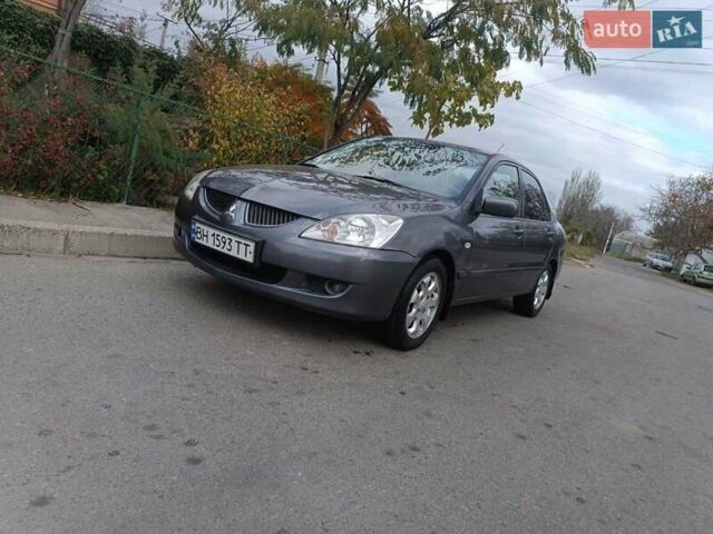 Сірий Міцубісі Lancer, об'ємом двигуна 1.58 л та пробігом 238 тис. км за 5500 $, фото 1 на Automoto.ua