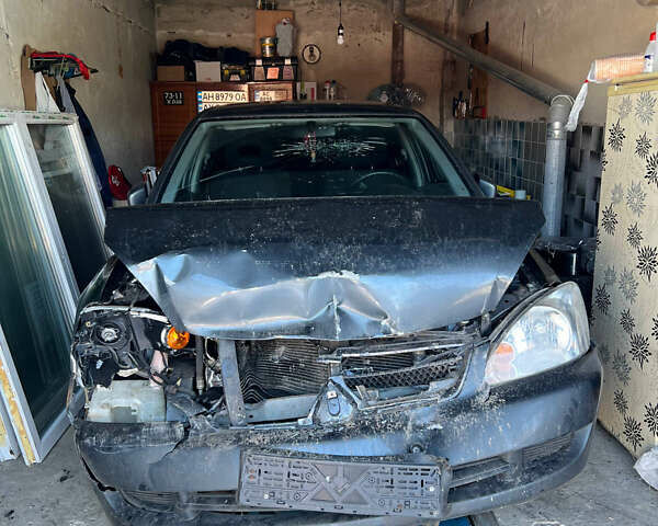 Сірий Міцубісі Lancer, об'ємом двигуна 1.58 л та пробігом 299 тис. км за 2299 $, фото 1 на Automoto.ua