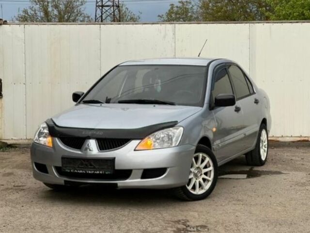 Серый Мицубиси Лансер, объемом двигателя 1.6 л и пробегом 178 тыс. км за 3200 $, фото 1 на Automoto.ua