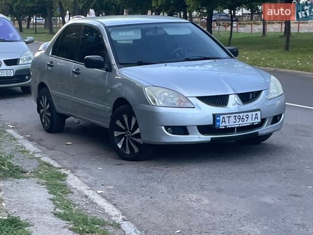 Серый Мицубиси Лансер, объемом двигателя 1.58 л и пробегом 190 тыс. км за 2600 $, фото 1 на Automoto.ua