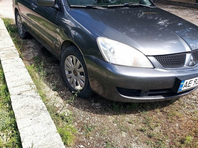 Сірий Міцубісі Lancer, об'ємом двигуна 1.58 л та пробігом 248 тис. км за 3700 $, фото 1 на Automoto.ua