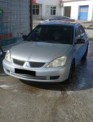 Серый Мицубиси Лансер, объемом двигателя 1.59 л и пробегом 60 тыс. км за 3000 $, фото 1 на Automoto.ua