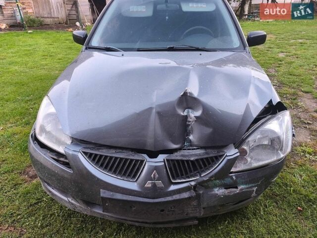 Сірий Міцубісі Lancer, об'ємом двигуна 1.58 л та пробігом 240 тис. км за 1500 $, фото 1 на Automoto.ua