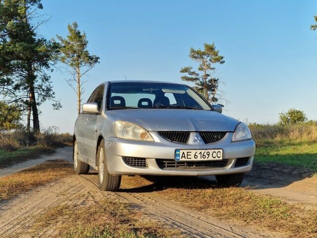 Сірий Міцубісі Lancer, об'ємом двигуна 1.6 л та пробігом 330 тис. км за 1704 $, фото 1 на Automoto.ua