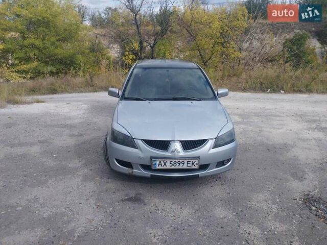 Сірий Міцубісі Lancer, об'ємом двигуна 1.6 л та пробігом 244 тис. км за 3300 $, фото 1 на Automoto.ua
