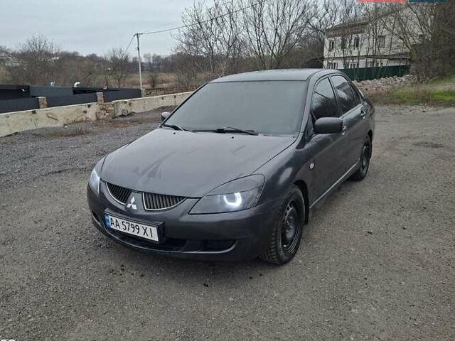 Серый Мицубиси Лансер, объемом двигателя 1.6 л и пробегом 305 тыс. км за 4000 $, фото 1 на Automoto.ua