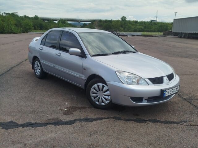 Серый Мицубиси Лансер, объемом двигателя 1.6 л и пробегом 250 тыс. км за 3600 $, фото 1 на Automoto.ua