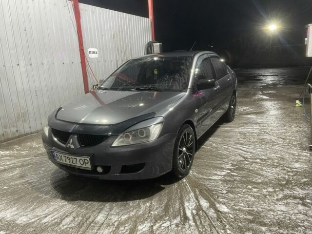 Серый Мицубиси Лансер, объемом двигателя 1.6 л и пробегом 300 тыс. км за 3600 $, фото 1 на Automoto.ua