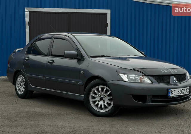 Серый Мицубиси Лансер, объемом двигателя 1.58 л и пробегом 224 тыс. км за 3499 $, фото 1 на Automoto.ua