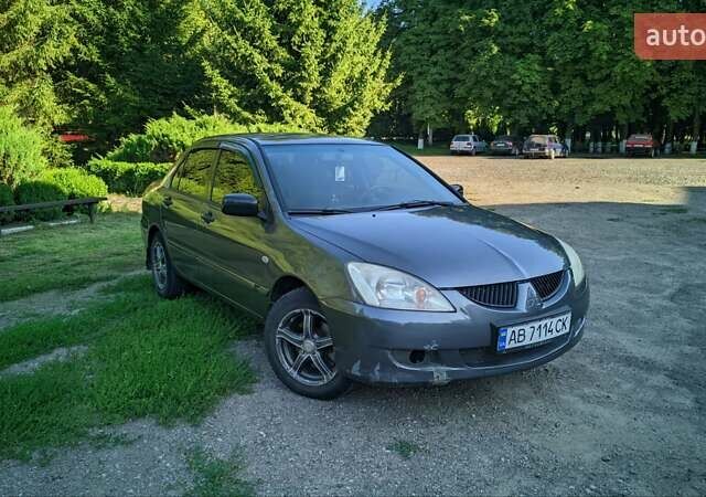 Серый Мицубиси Лансер, объемом двигателя 1.58 л и пробегом 301 тыс. км за 3700 $, фото 1 на Automoto.ua