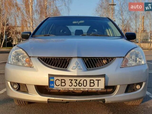 Серый Мицубиси Лансер, объемом двигателя 1.58 л и пробегом 245 тыс. км за 3300 $, фото 1 на Automoto.ua