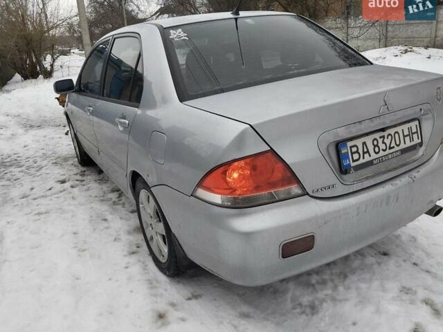 Серый Мицубиси Лансер, объемом двигателя 1.6 л и пробегом 195 тыс. км за 4000 $, фото 1 на Automoto.ua
