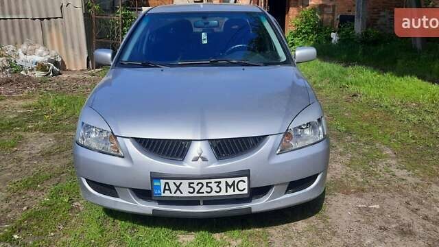 Сірий Міцубісі Lancer, об'ємом двигуна 1.58 л та пробігом 250 тис. км за 5000 $, фото 1 на Automoto.ua