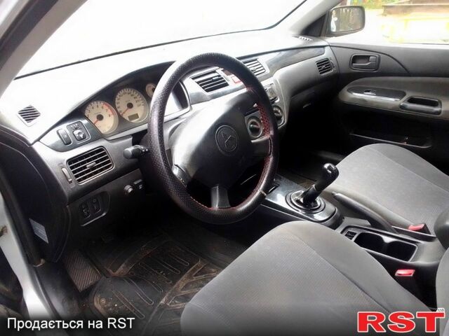 Сірий Міцубісі Lancer, об'ємом двигуна 1.6 л та пробігом 360 тис. км за 1999 $, фото 1 на Automoto.ua