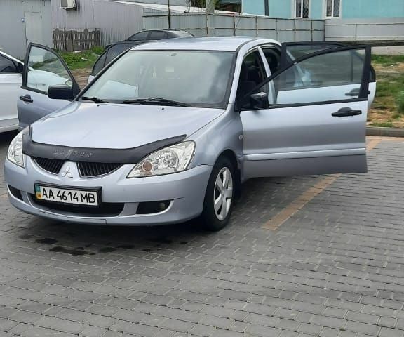 Серый Мицубиси Лансер, объемом двигателя 1.6 л и пробегом 277 тыс. км за 3500 $, фото 1 на Automoto.ua