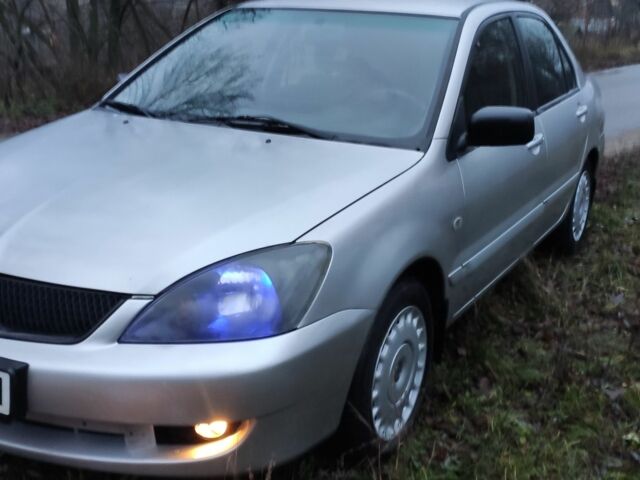 Серый Мицубиси Лансер, объемом двигателя 1.6 л и пробегом 235 тыс. км за 2850 $, фото 1 на Automoto.ua