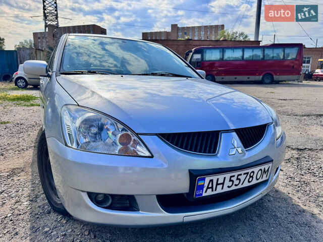 Сірий Міцубісі Lancer, об'ємом двигуна 1.58 л та пробігом 292 тис. км за 5000 $, фото 1 на Automoto.ua