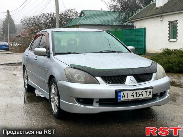 Сірий Міцубісі Lancer, об'ємом двигуна 2 л та пробігом 231 тис. км за 3799 $, фото 1 на Automoto.ua