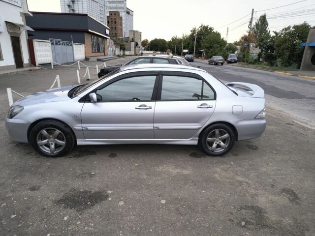 Серый Мицубиси Лансер, объемом двигателя 2 л и пробегом 212 тыс. км за 4300 $, фото 1 на Automoto.ua