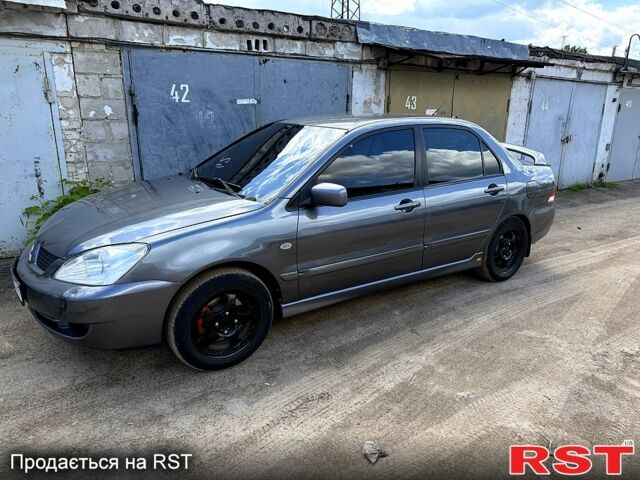 Серый Мицубиси Лансер, объемом двигателя 1.6 л и пробегом 300 тыс. км за 3850 $, фото 1 на Automoto.ua